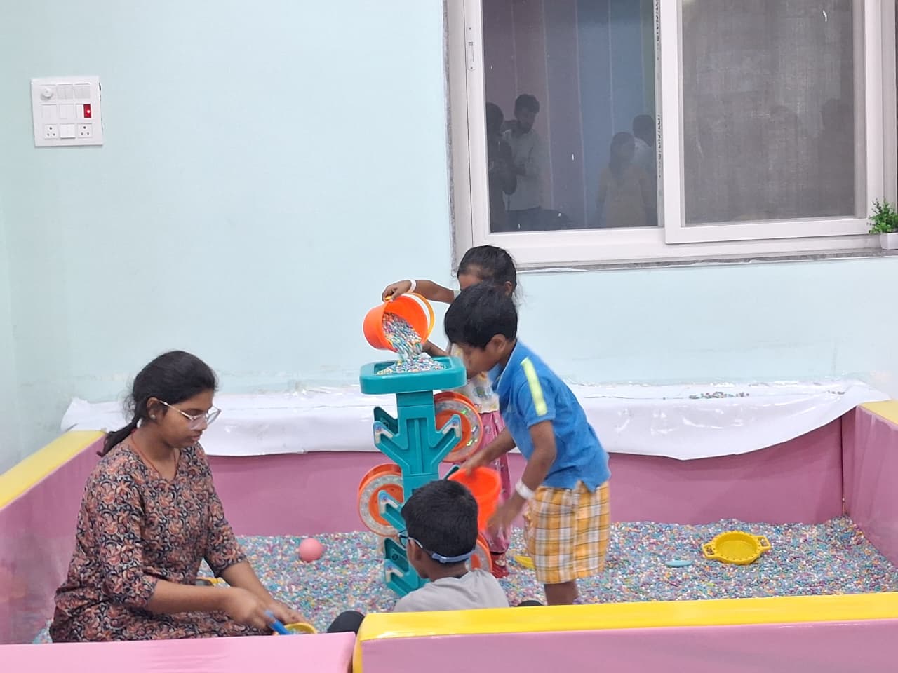 Child and parent enjoying a sensory play area in Boduppal